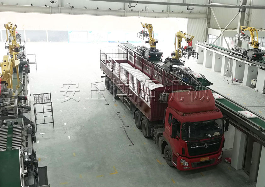 尿素顆粒自動裝車機器人 25kg尿素全自動裝車機械手現場